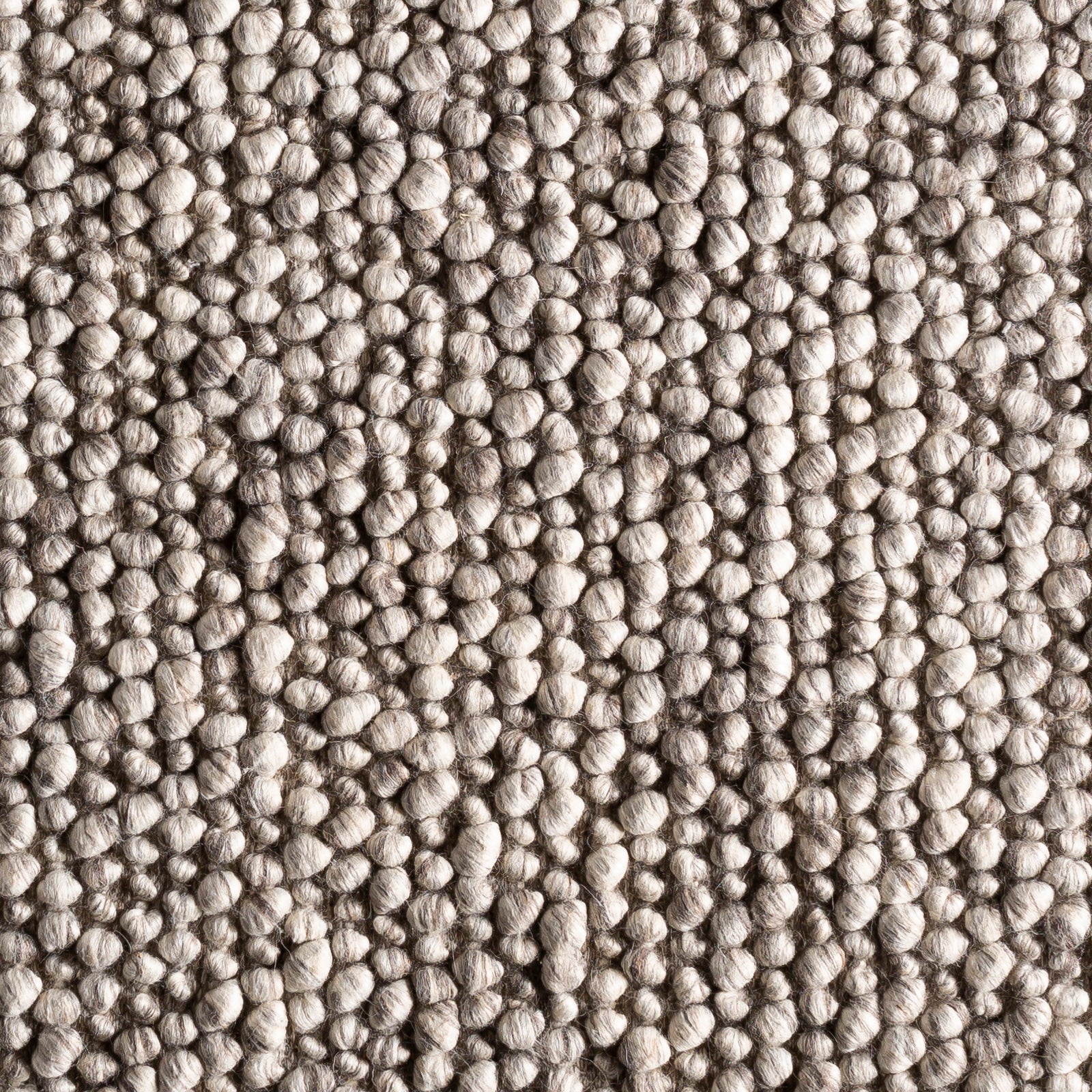 The Ambergris rug has a soft buble like texture that adds comfort to any room.