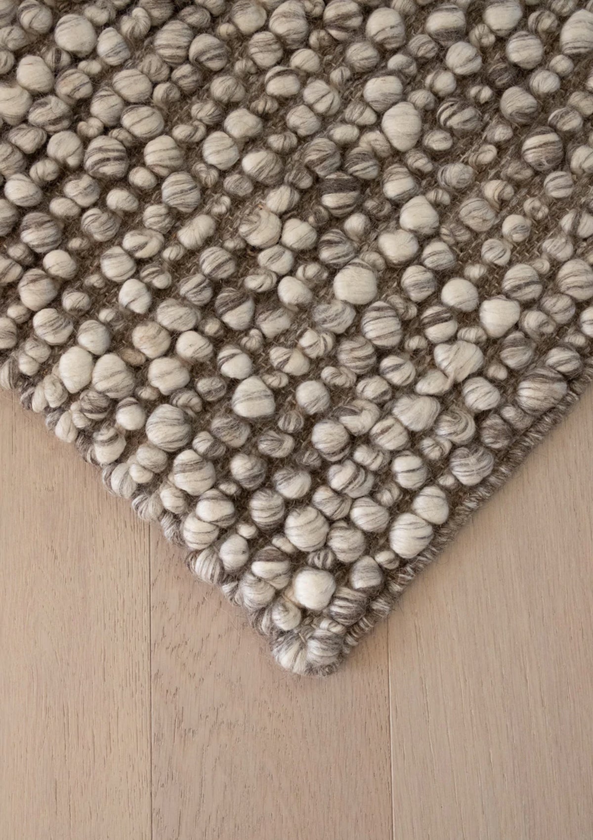 The Ambergris rug is hand woven from wool and viscose.