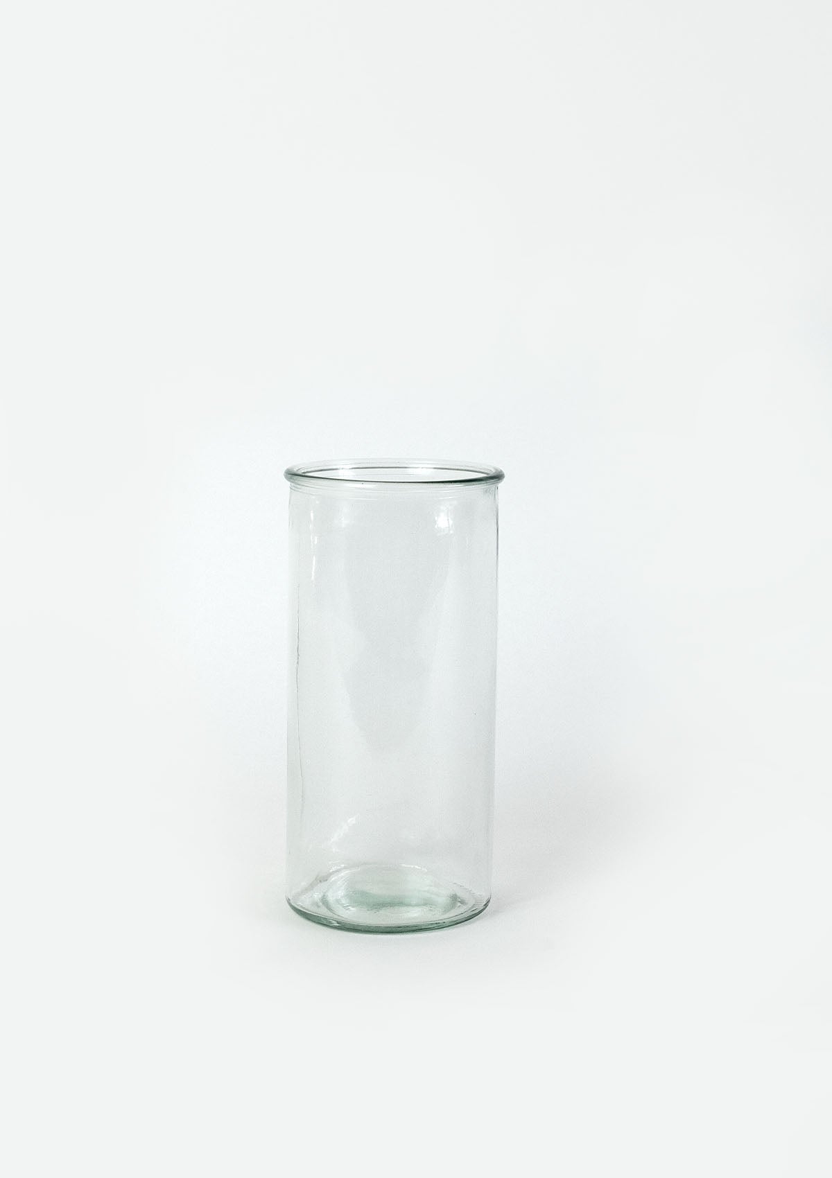 The Aura clear glass vase has a small lip at the opening of the vase.