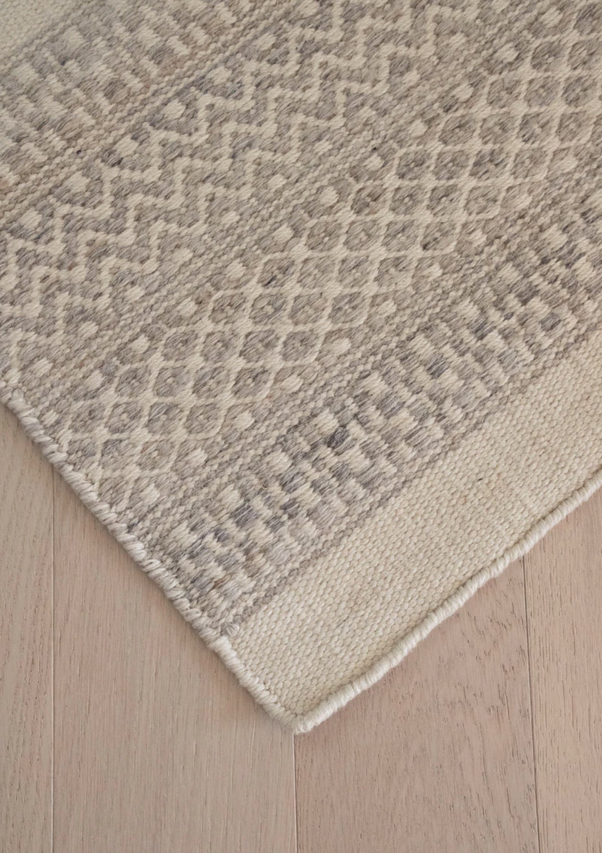 The Catalina Rug features a repetative triangle pattern.