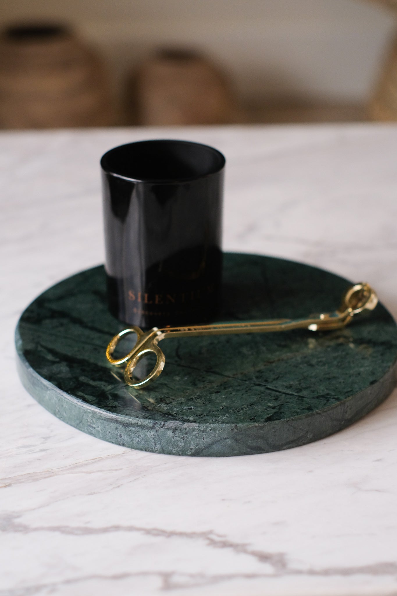 The Lovell Marble Plate has a shallow flat bowl that could display candels or hold jewlery or keys.