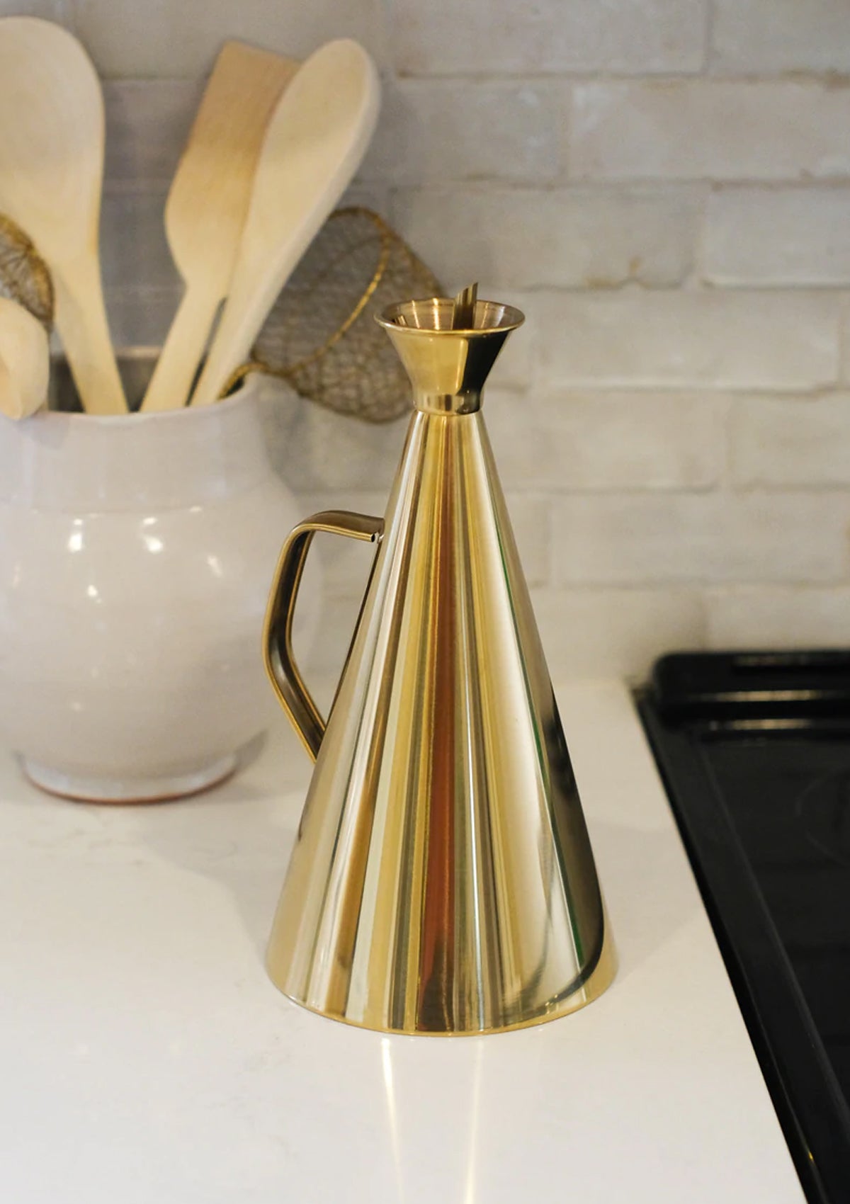 The Lydia Oil Cruet has a simple design made of stainless steal with a stunning gold finish.