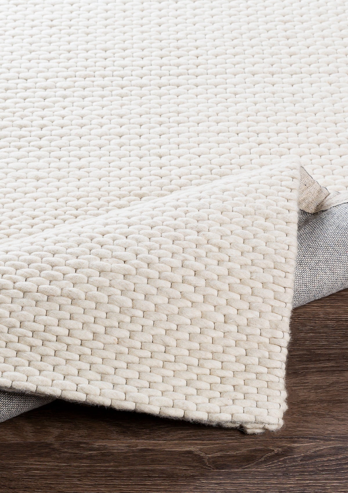 The Olaine Rug is made from 100% wool and has a canvas backing.