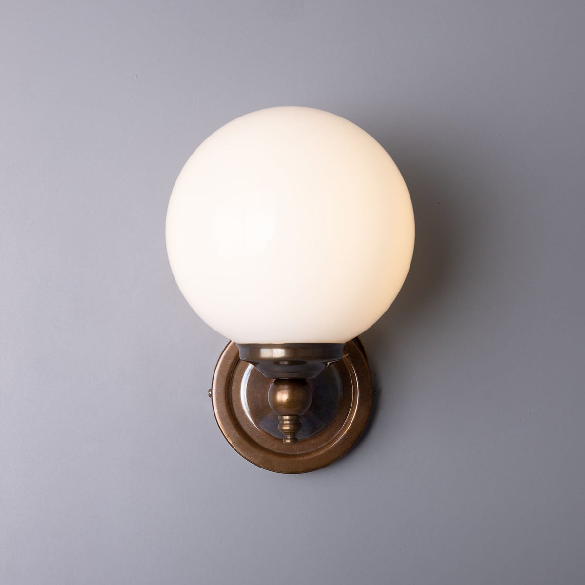 Cloghan Traditional Brass and Opal Glass Globe Wall Sconce – Antique Brass