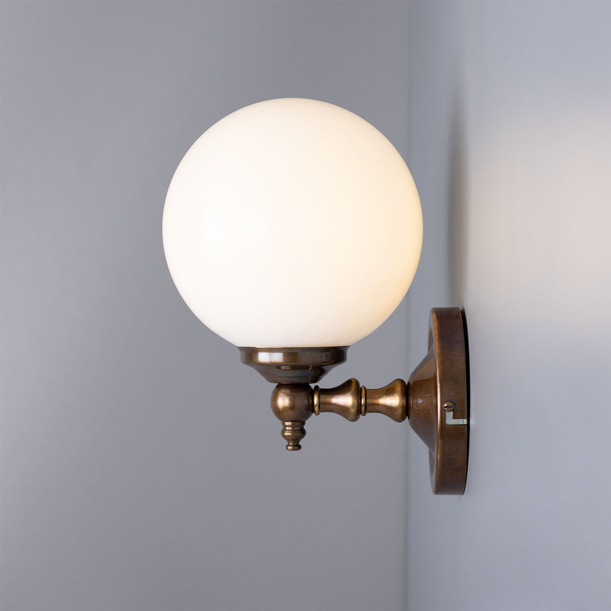 Cloghan Traditional Brass and Opal Glass Globe Wall Sconce – Antique Brass