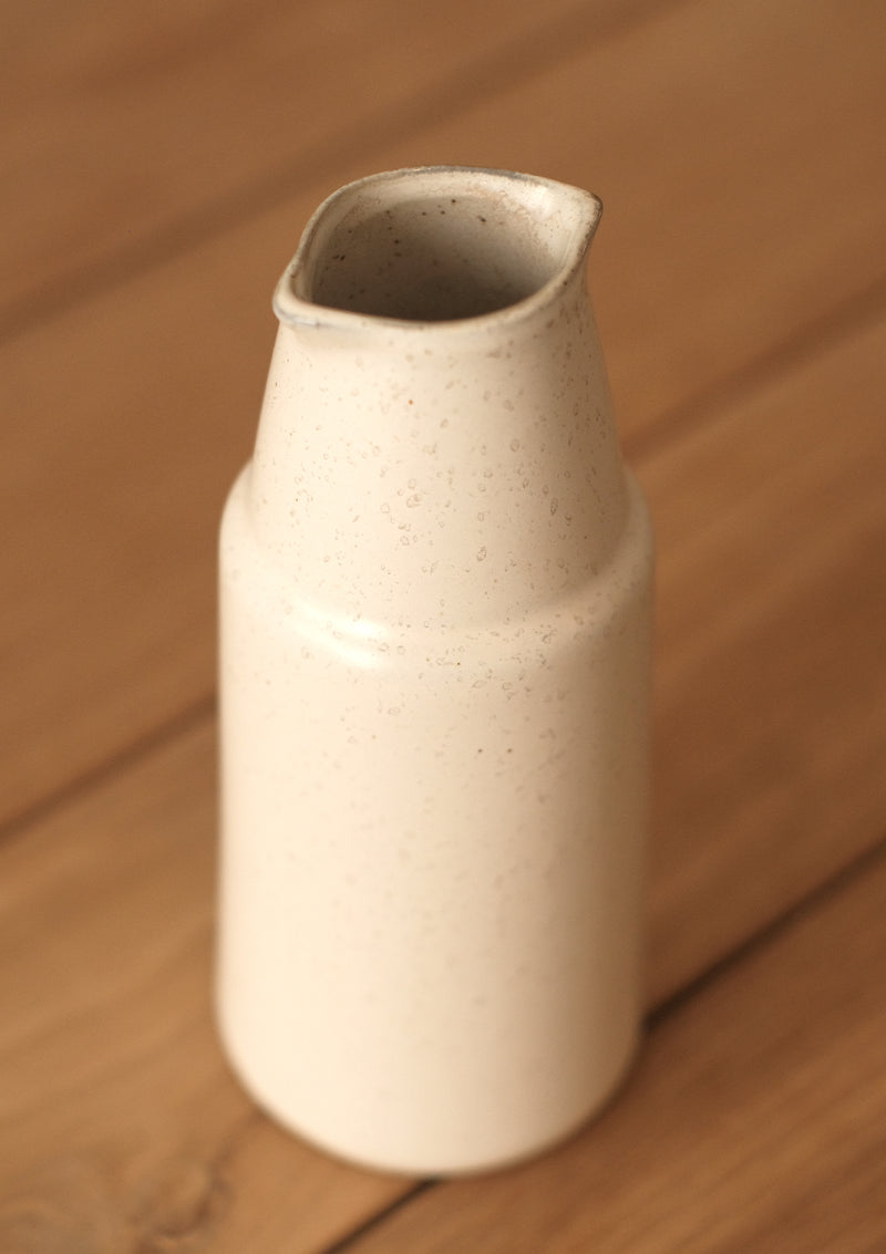 The Ansel Bottle has oval opening and a round base.