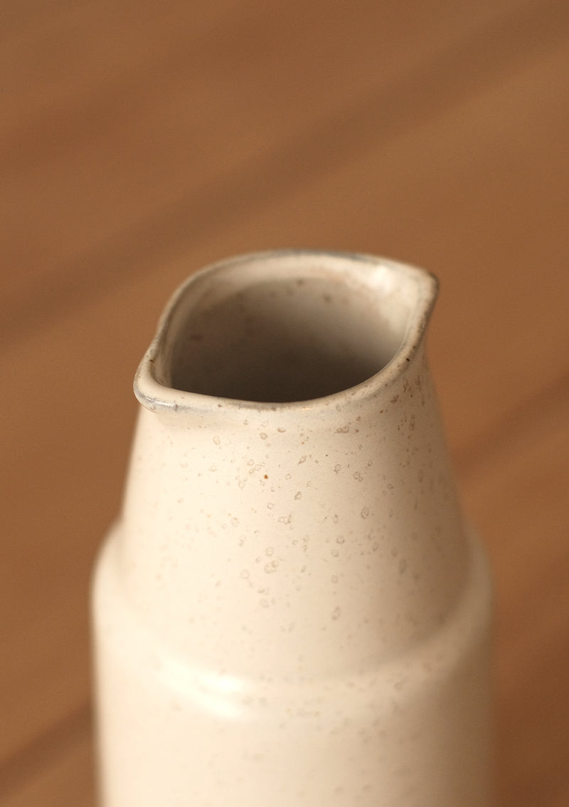 The Ansel Bottle has a cream colouring with light beige spots.