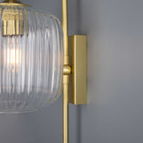 The Astoria wall light has a brass base and arm that comes in four colour finish options. 