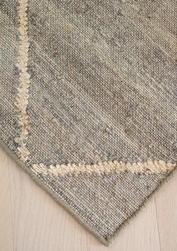 The Bermuda rug has a diamond design and comes in caramel, cream, khaki, ivory, and taupe tones. 