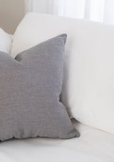 The Adora Pillow cover in grey has a subtle stipe pattern.