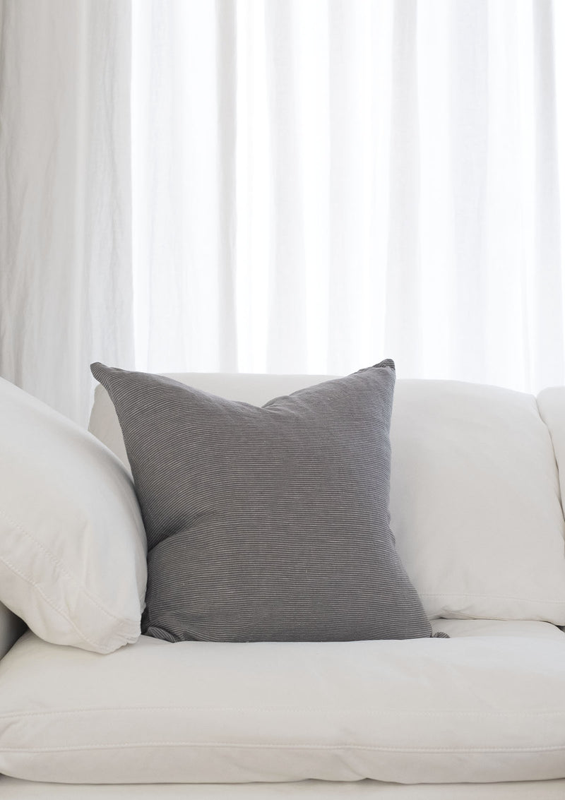 The grey Adora pillow cover comes in a stunning light grey colour and is made of soft linen.