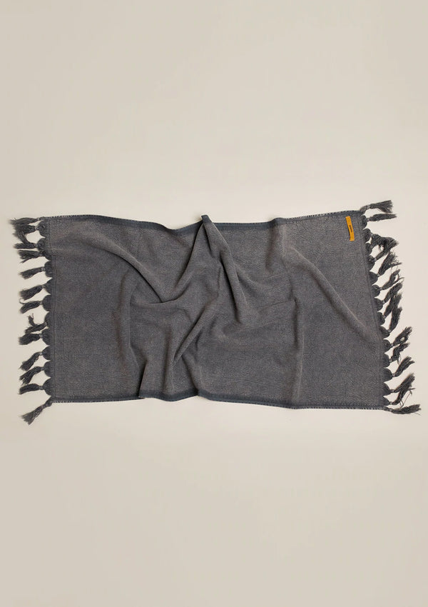 This Vintage Wash Hand Towel comes in a worn charcoal and is made of soft cotton. 