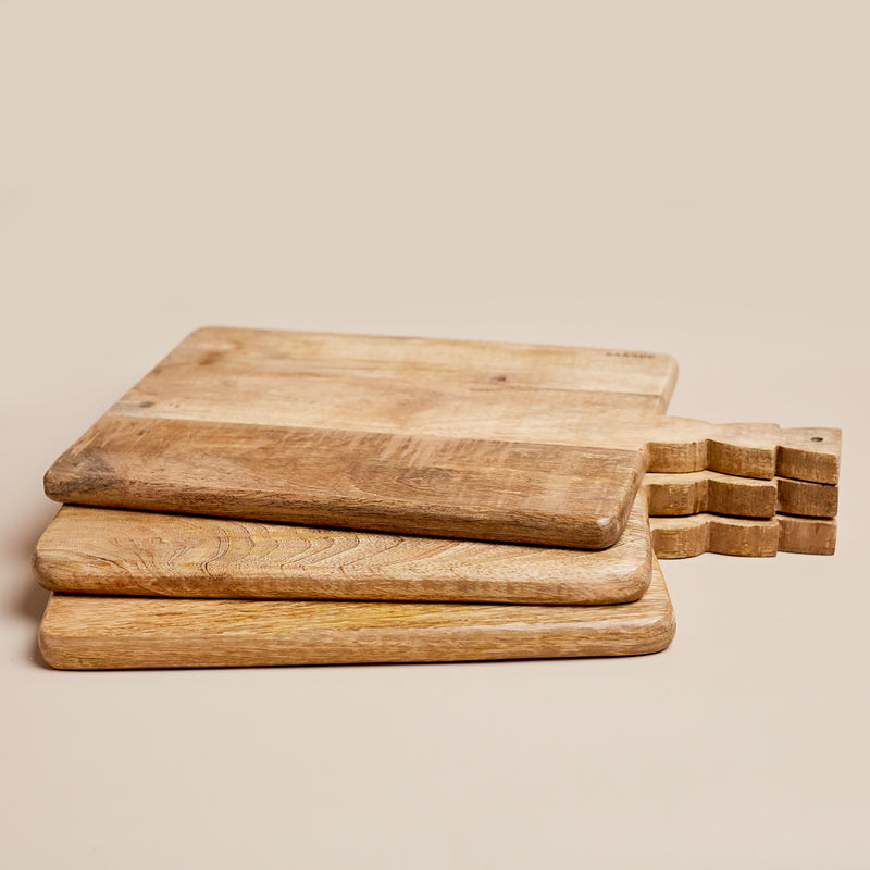 The Small Ekmek Bread Board has a unique stacked triangle shaped handle. 