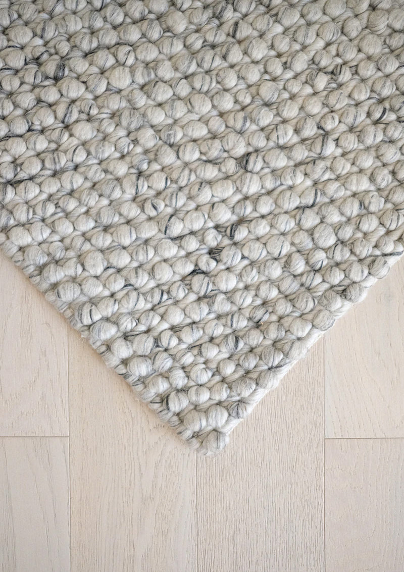 The Lark Rug is hand woven and is made of 60% Wool, and 40% Polyester.