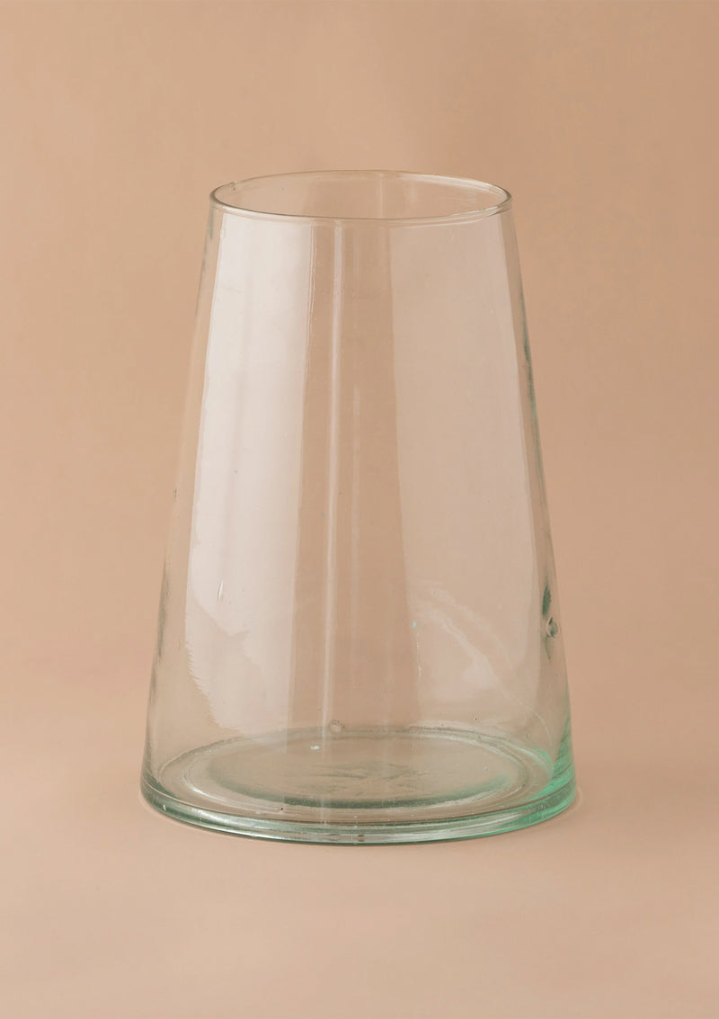 Simple and smooth this glass vase is the perfect modern vase to add greenery or flowers to a home.