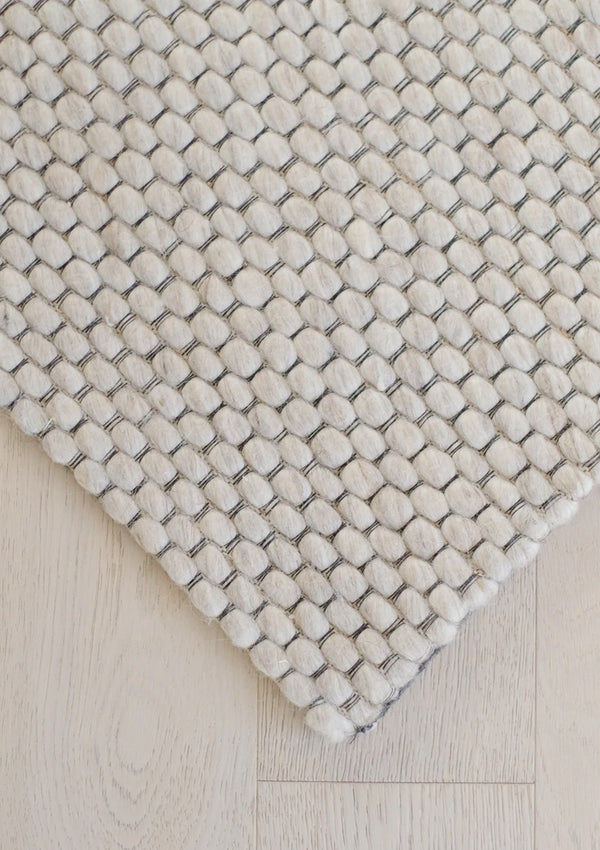 The Nowa Rug is hand woven from 100% wool and has no pile.