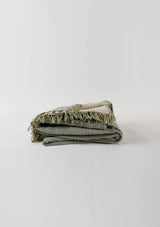 The Enes Cotton Throw has beautiful fringe ends.