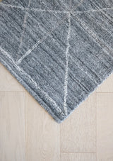 The Rafe Rug features a faint abstract line pattern. 