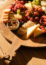 The round Yufka Grazing Board is made from non-porous and durable mango wood. 